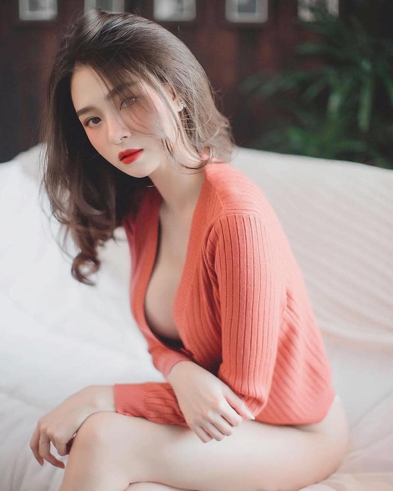 A Thai woman in revealing red top